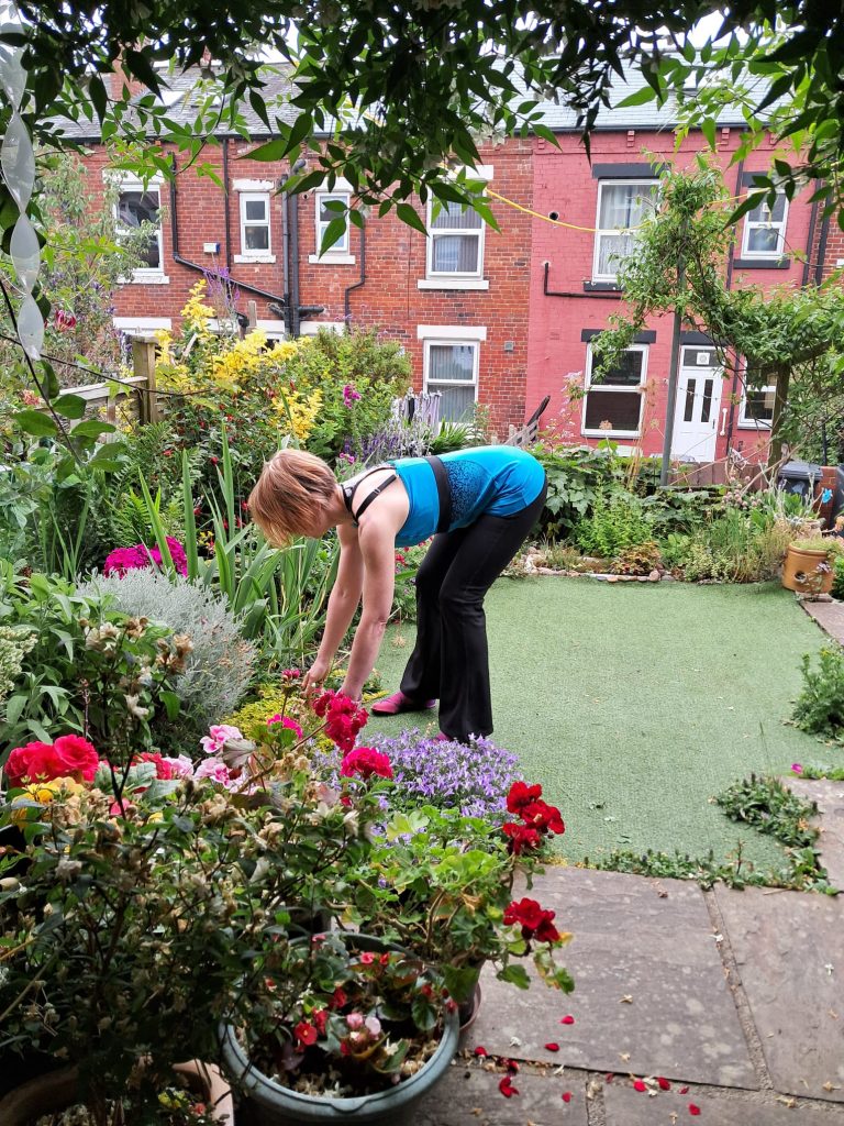 Author doing gardening and bending using the hips