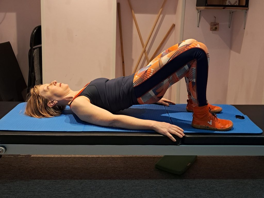 Author demonstrating glute bridge